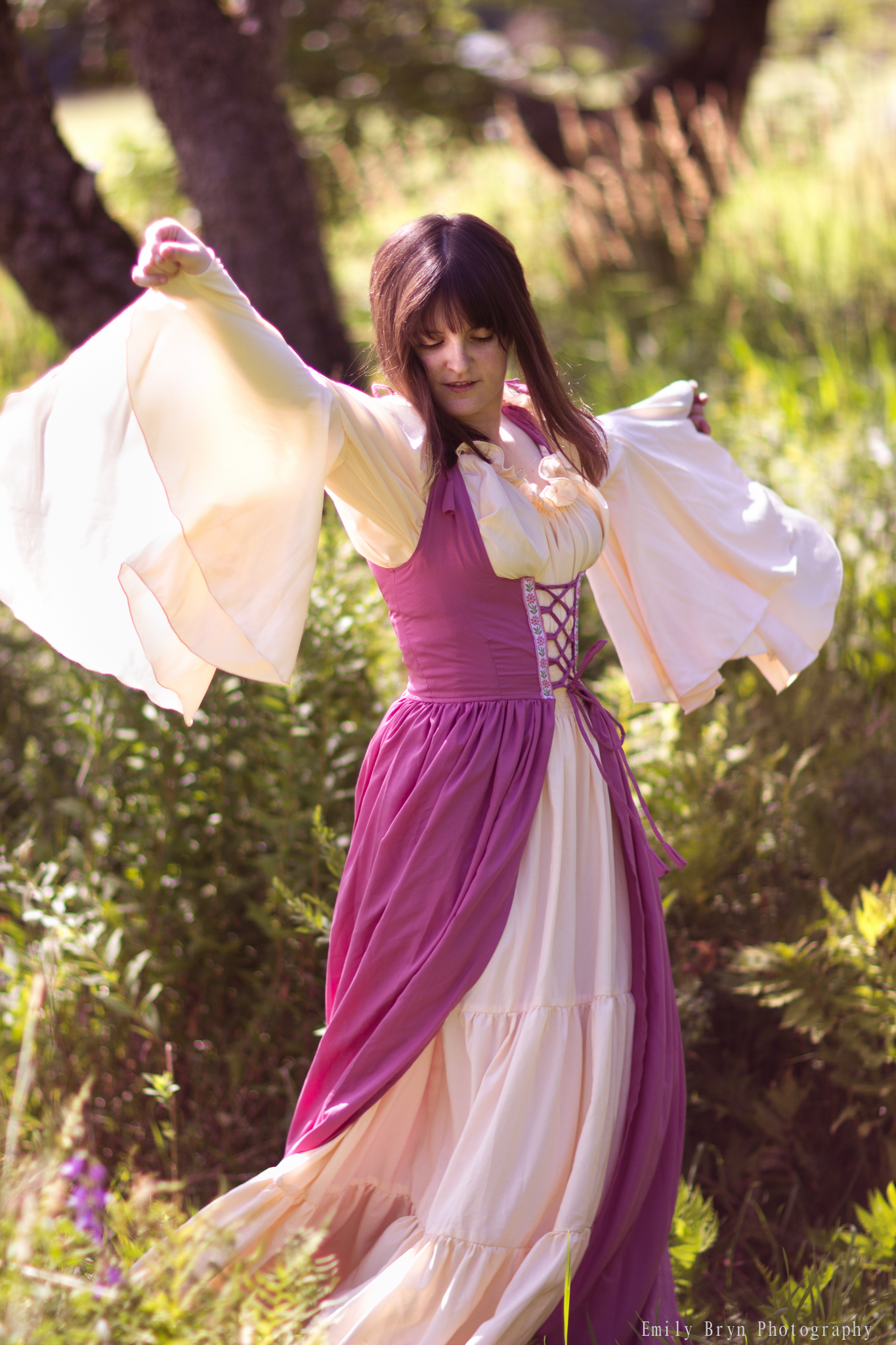 Woman spinning in a Renaissance dress.