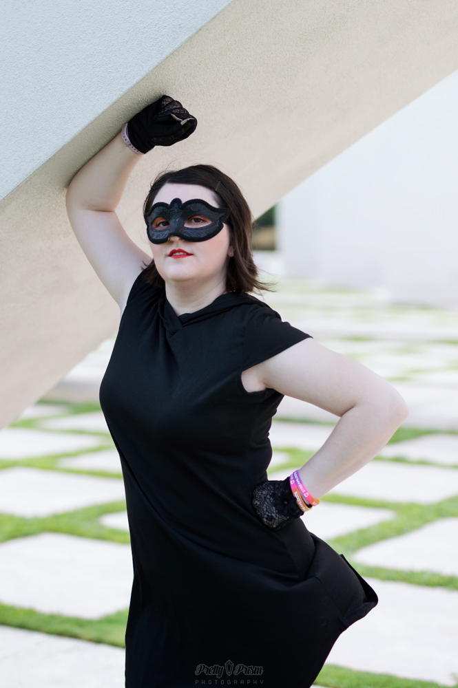 Pizza Thief posing with her arm above head.