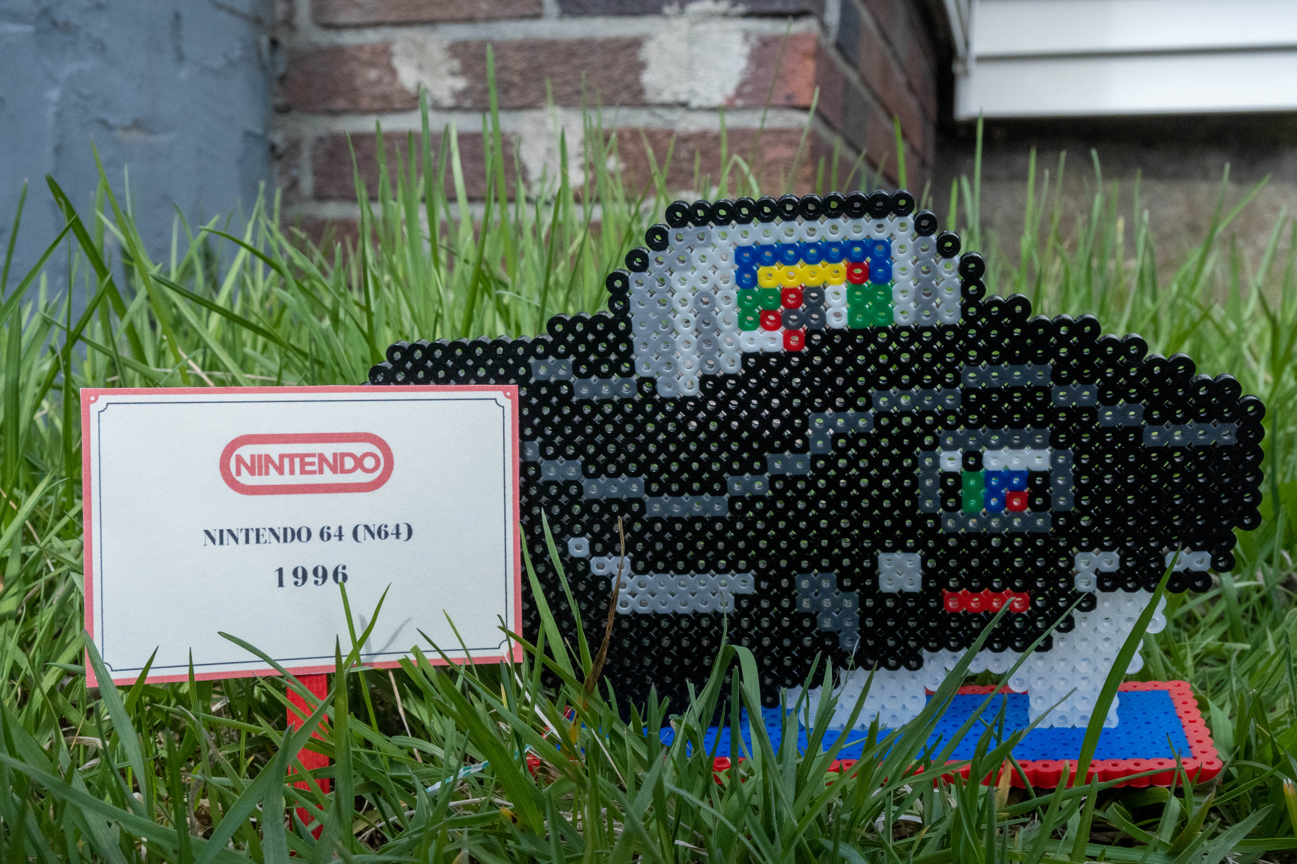 Black Nintendo 64 system made out of Perler brand fuse beads.